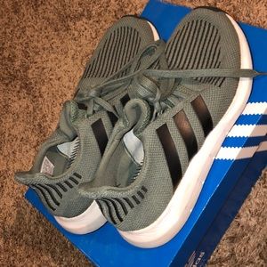 Green,black, and white adidas